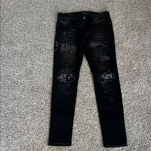 AMIRI Black Distressed Skinny Jeans